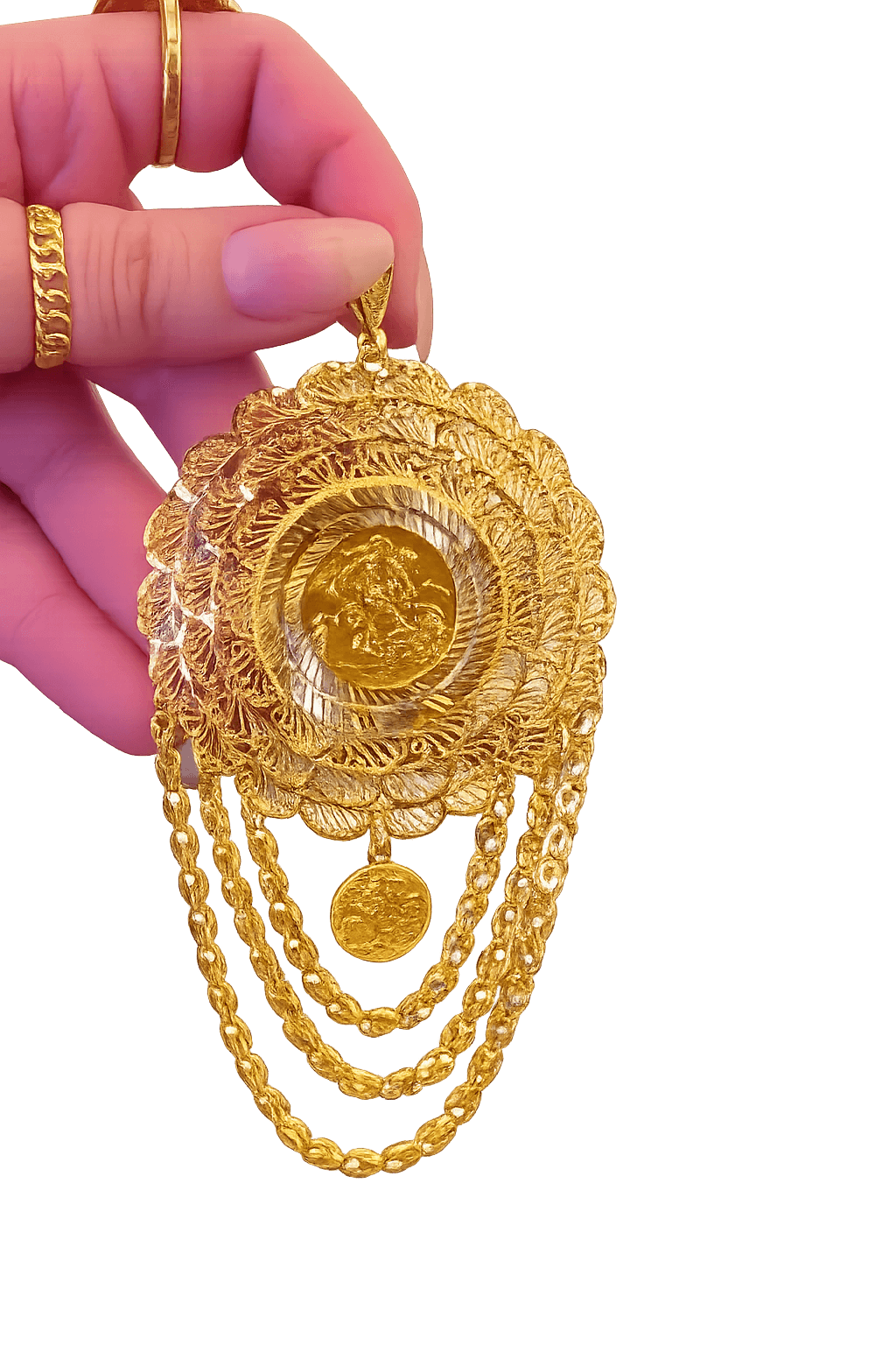 Filigree gold medallion suspended from a fingertip with cascading chainwork